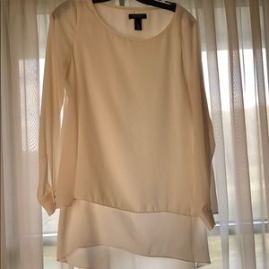 Cream colored blouse with layers
